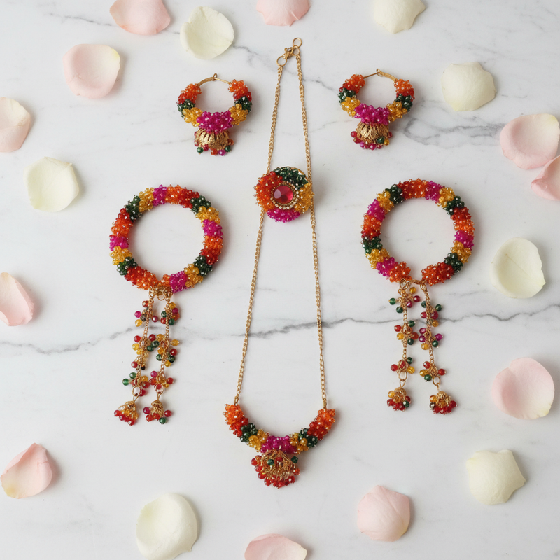 Multicolor crystal beaded jewellery set flat lay white marble